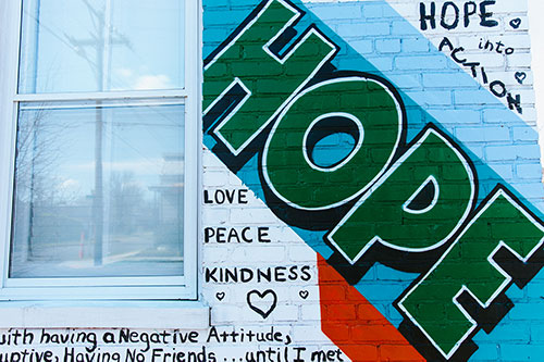 Part of a Giving Wall mural showing the word Hope